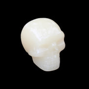 Honey Calcite skull hand-carved 55*47*38mm 183g in sunlight - Rocks and Things Store