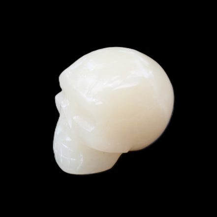 Honey Calcite skull hand-carved 55*47*38mm 183g in sunlight - Rocks and Things Store