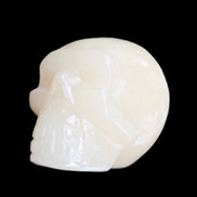 Honey Calcite skull hand-carved 55*47*38mm 183g in sunlight - Rocks and Things Store