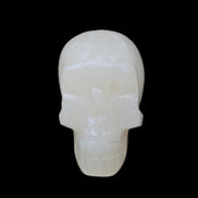 Honey Calcite skull hand-carved 55*47*38mm 183g in sunlight - Rocks and Things Store