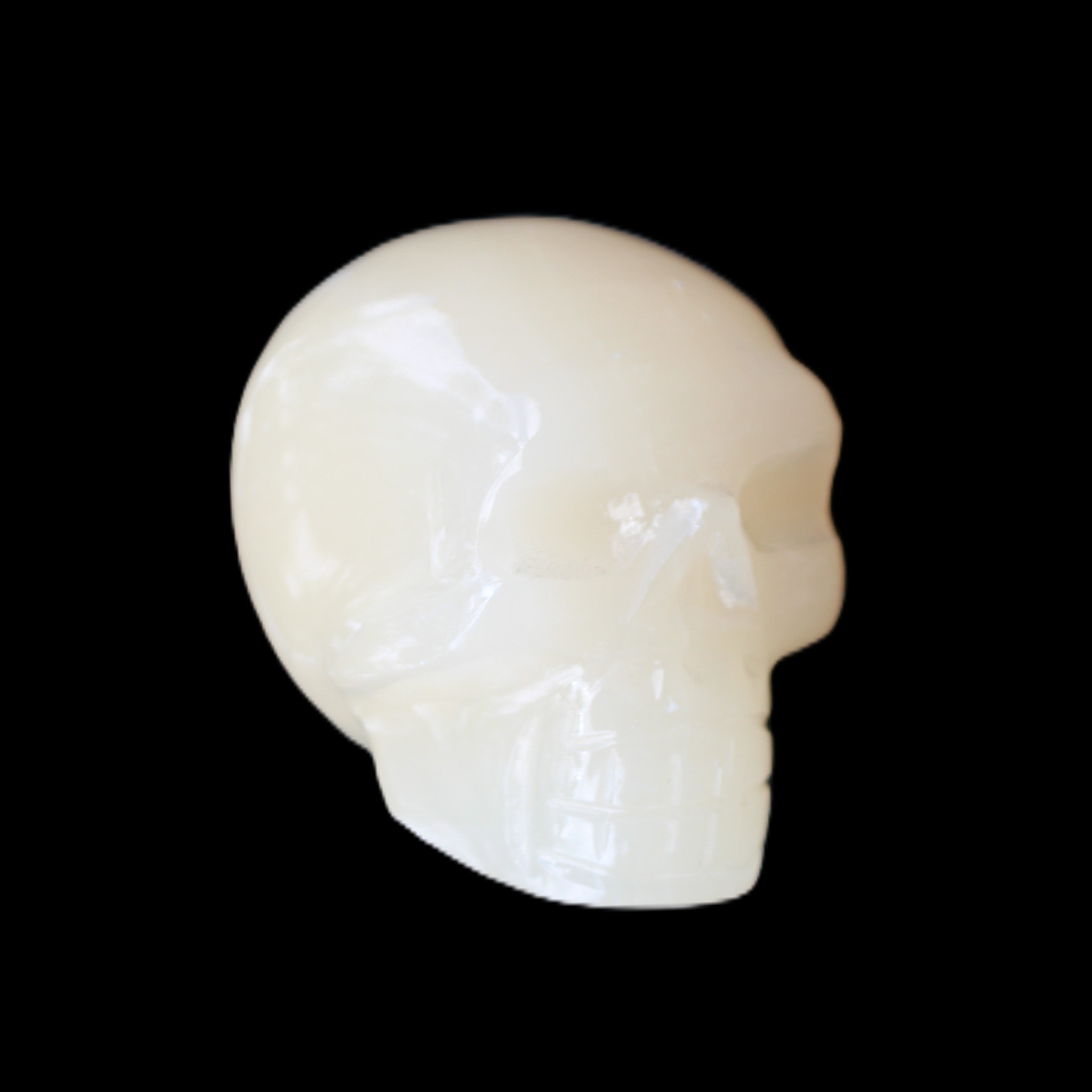 Honey Calcite skull hand-carved 55*47*38mm 183g in sunlight - Rocks and Things Store