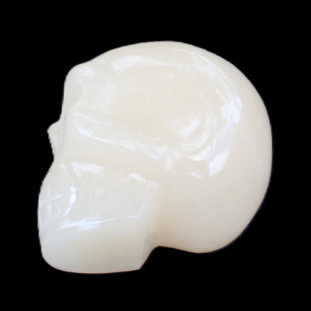 Honey Calcite skull hand-carved 55*47*38mm 183g in sunlight - Rocks and Things Store