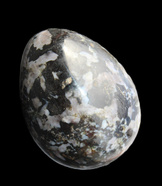 Indigo Gabbro Mystic Merlinite egg 111g in sunlight - Rocks and Things Store