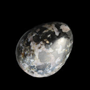 Indigo Gabbro Mystic Merlinite egg 111g in sunlight - Rocks and Things Store