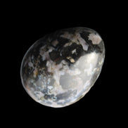 Indigo Gabbro Mystic Merlinite egg 111g in sunlight - Rocks and Things Store