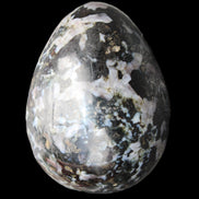 Indigo Gabbro Mystic Merlinite egg 111g in sunlight - Rocks and Things Store