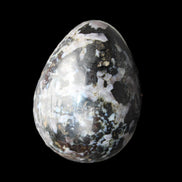 Indigo Gabbro Mystic Merlinite egg 111g in sunlight - Rocks and Things Store