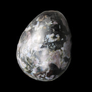 Indigo Gabbro Mystic Merlinite egg 111g in sunlight - Rocks and Things Store