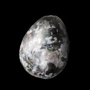 Indigo Gabbro Mystic Merlinite egg 111g in sunlight - Rocks and Things Store