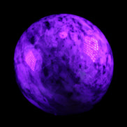 Pink Tourmaline sphere 60mm 357g in UV light - Rocks and Things Store
