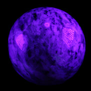 Pink Tourmaline sphere 60mm 357g in UV light - Rocks and Things Store