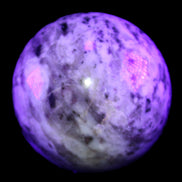 Pink Tourmaline sphere 60mm 357g in UV light - Rocks and Things Store