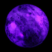 Pink Tourmaline sphere 60mm 357g in UV light - Rocks and Things Store