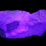Calcite cluster 1345g in UV light