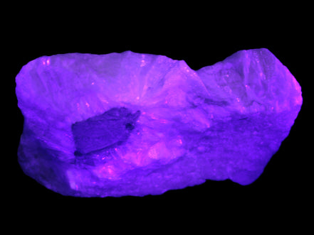 Calcite cluster 1345g in UV light