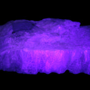 Calcite cluster 1345g in UV light