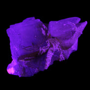 Clear Yellow Fluorite with 45mm dog-tooth Calcite 98*76*55mm 286g in UV light - Rocks and Things Store