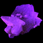 Clear Yellow Fluorite with 45mm dog-tooth Calcite 98*76*55mm 286g in UV light - Rocks and Things Store