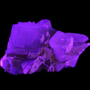 Clear Yellow Fluorite with 45mm dog-tooth Calcite 98*76*55mm 286g in UV light - Rocks and Things Store
