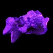 Clear Yellow Fluorite with 45mm dog-tooth Calcite 98*76*55mm 286g in UV light - Rocks and Things Store