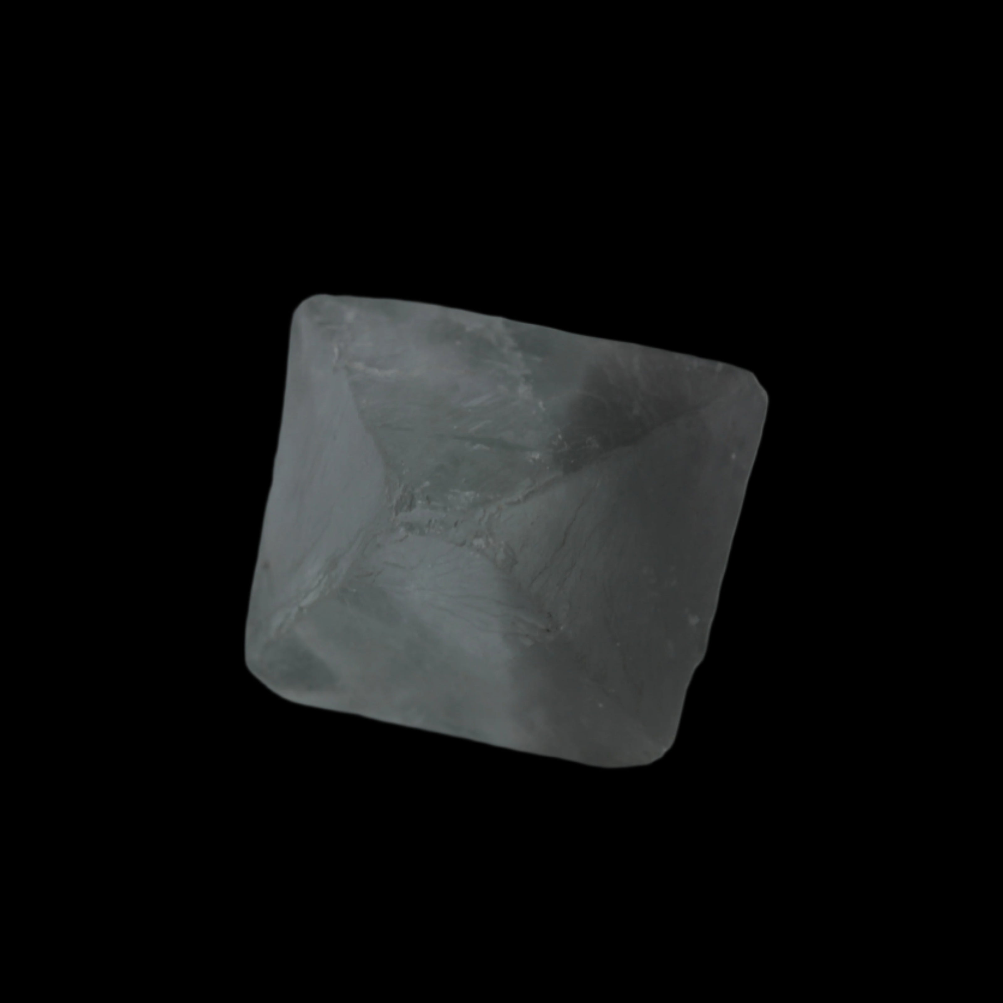 Fluorite octahedral crystal 26/33g  in dull sunlight - Rocks and Things Store