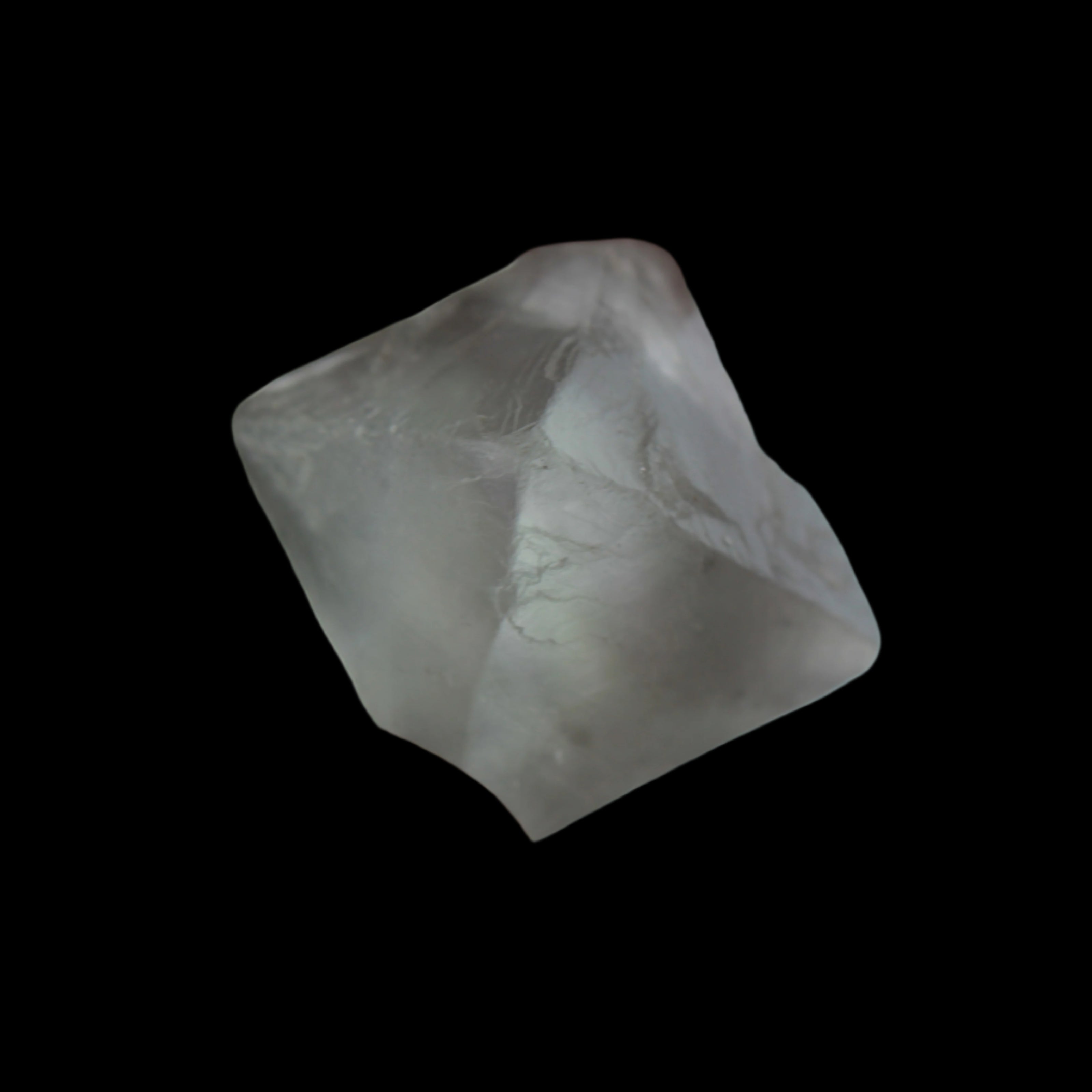 Fluorite octahedral crystal 26/33g  in dull sunlight - Rocks and Things Store