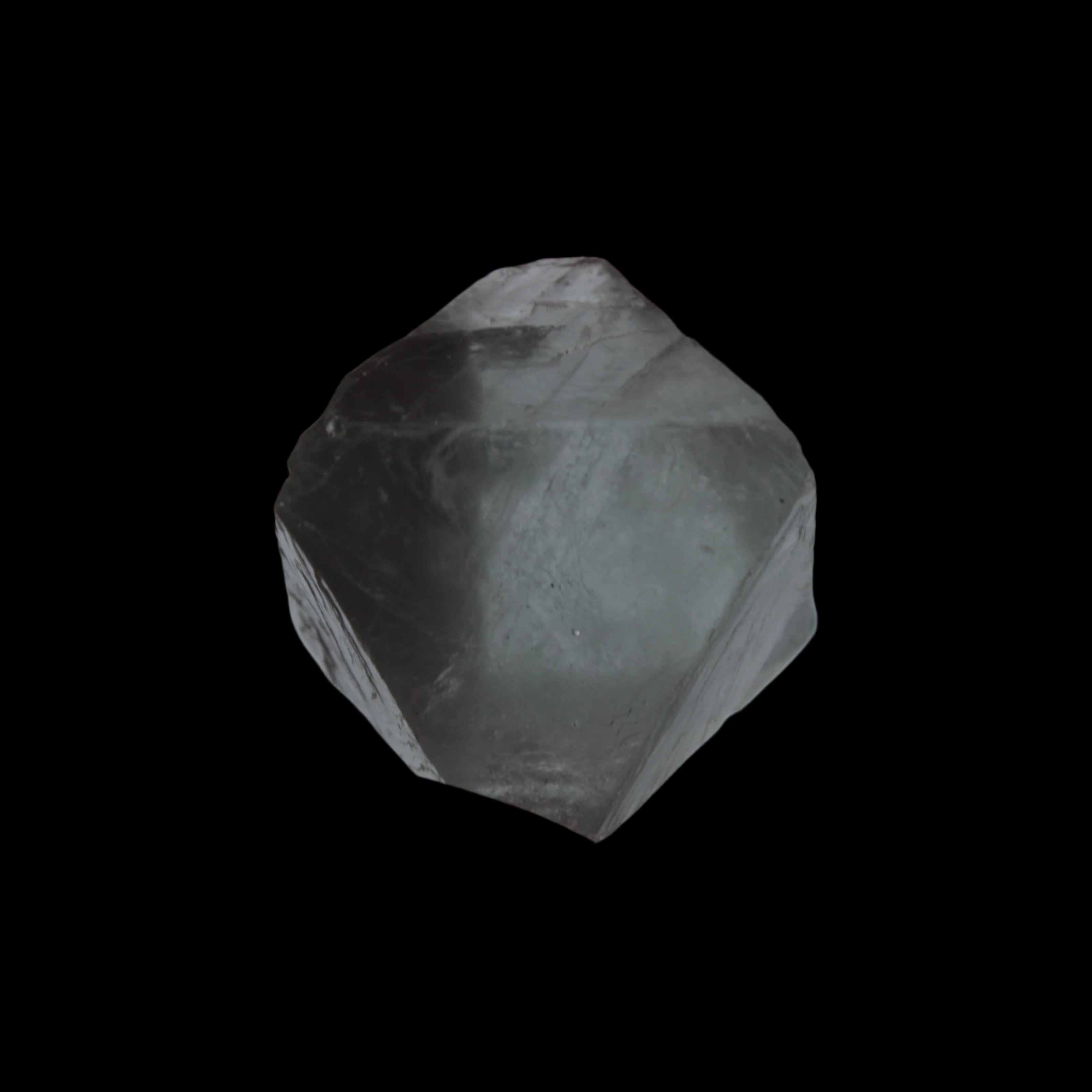 Fluorite octahedral crystal 26/33g  in dull sunlight - Rocks and Things Store