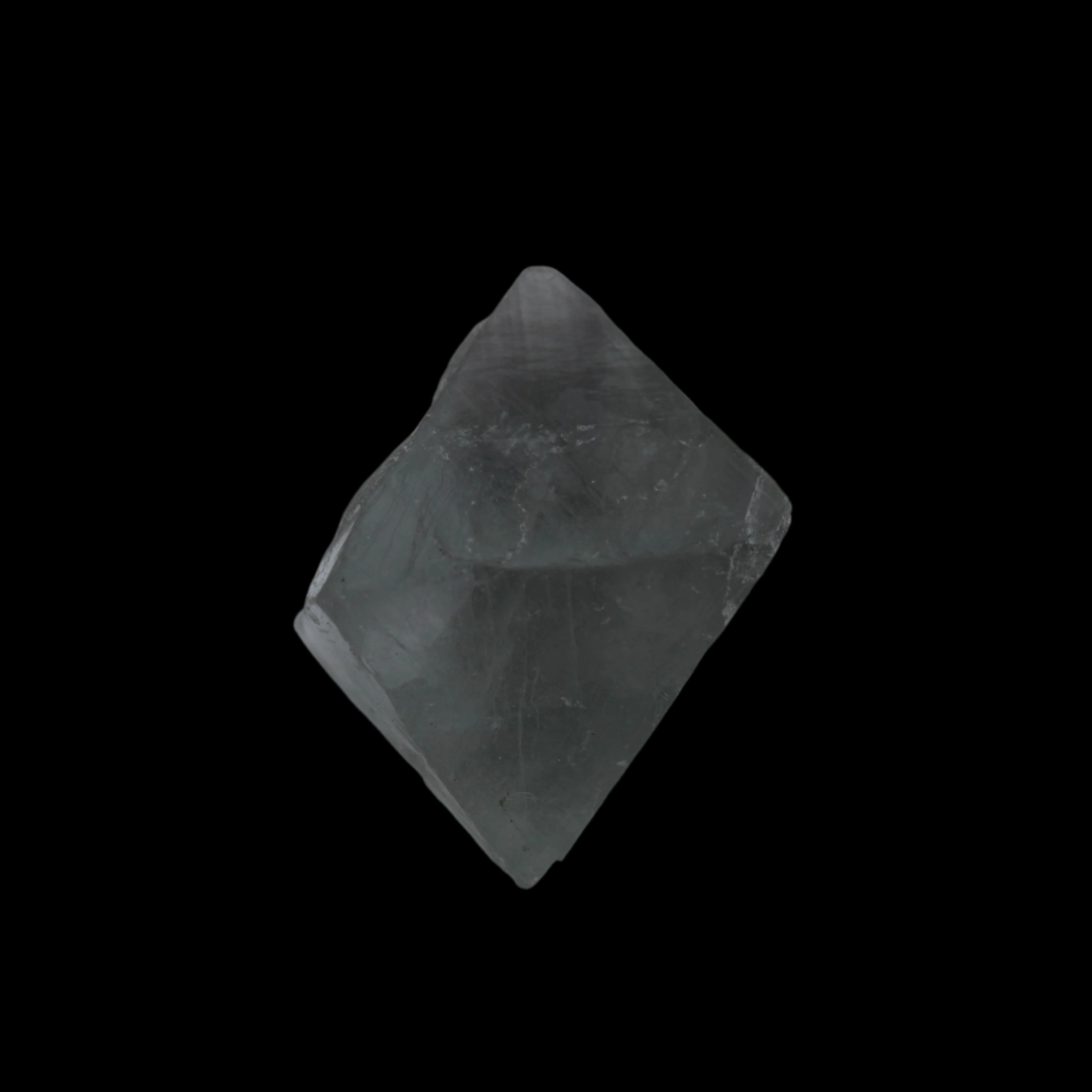 Fluorite octahedral crystal 26/33g  in dull sunlight - Rocks and Things Store