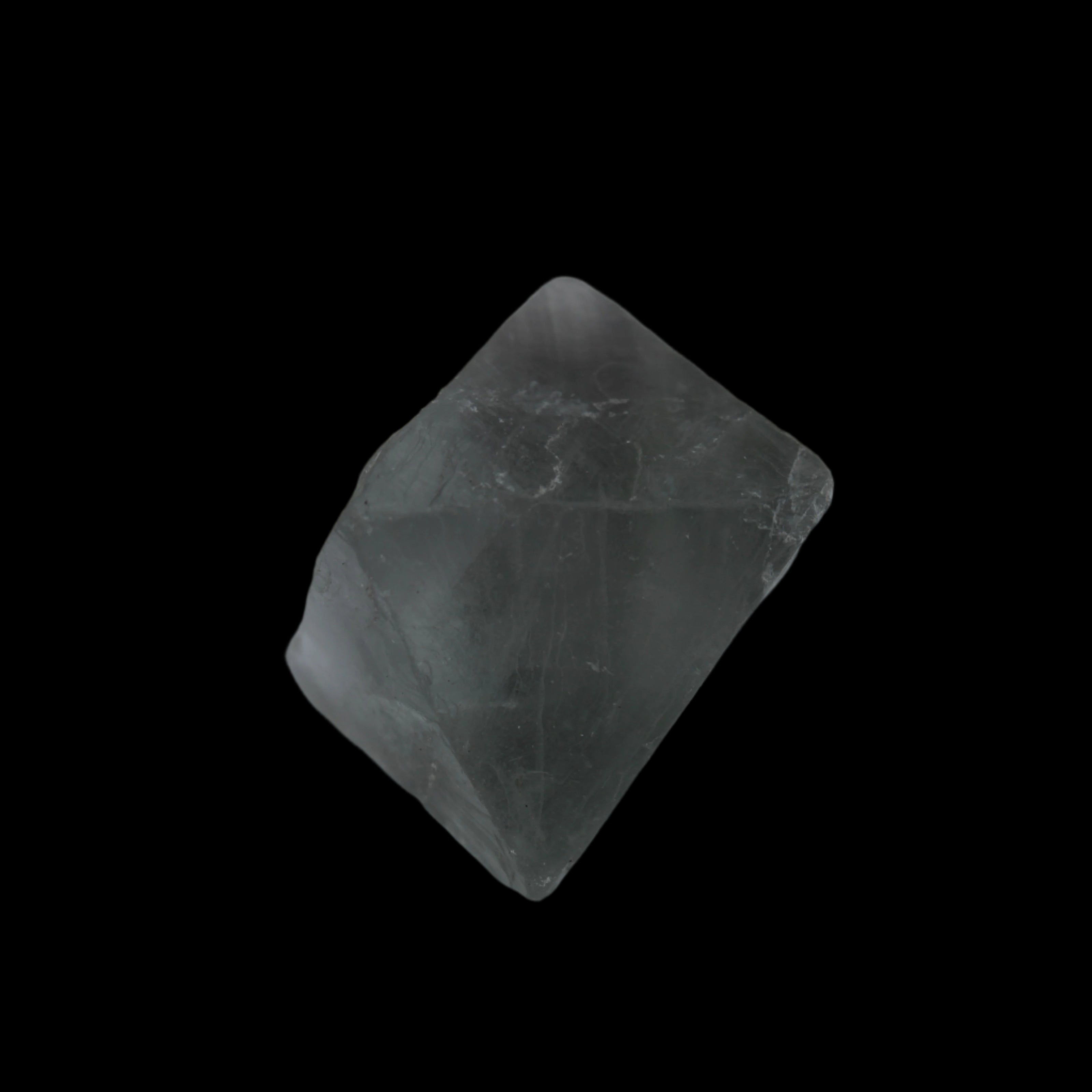 Fluorite octahedral crystal 26/33g  in dull sunlight - Rocks and Things Store