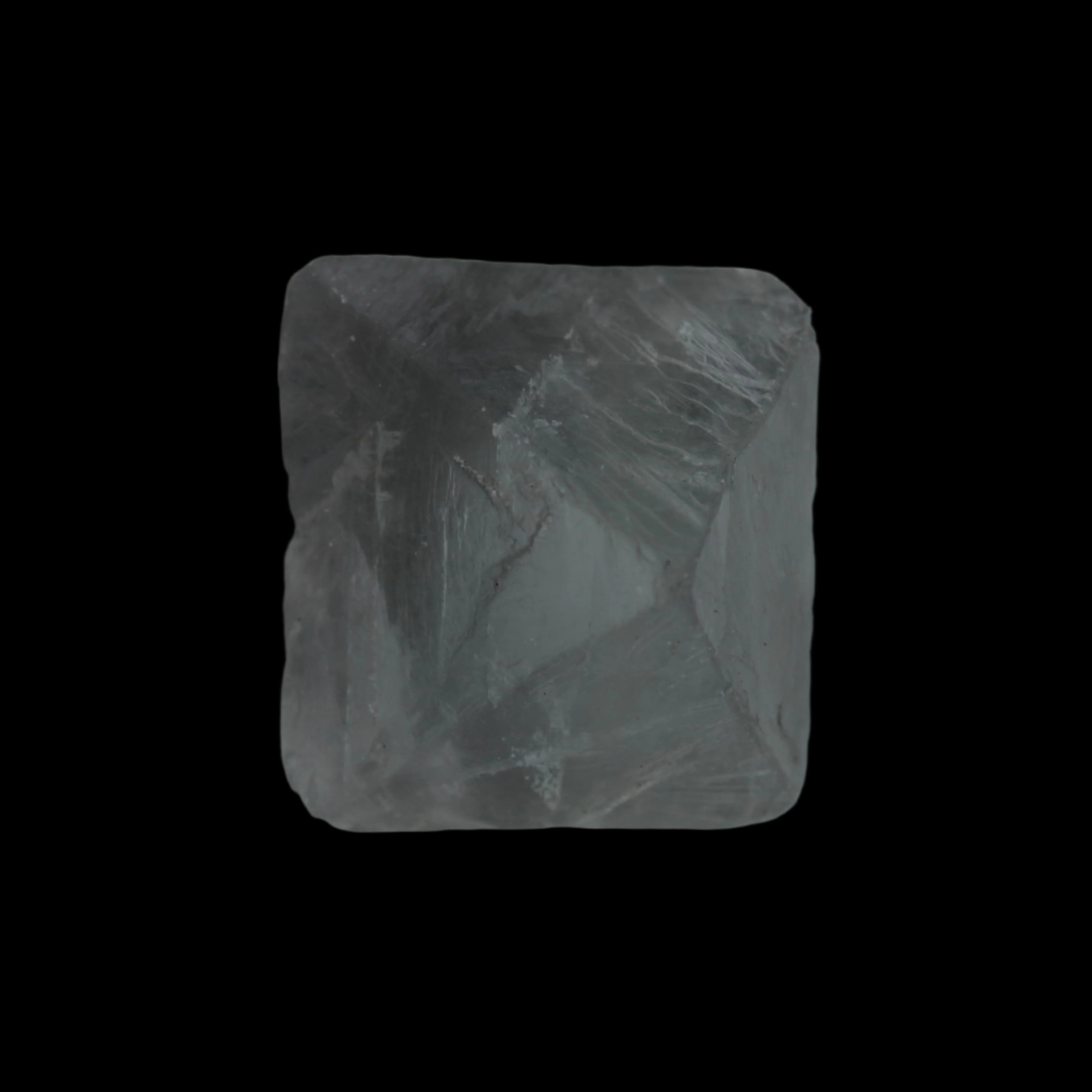Fluorite octahedral crystal 26/33g  in dull sunlight - Rocks and Things Store