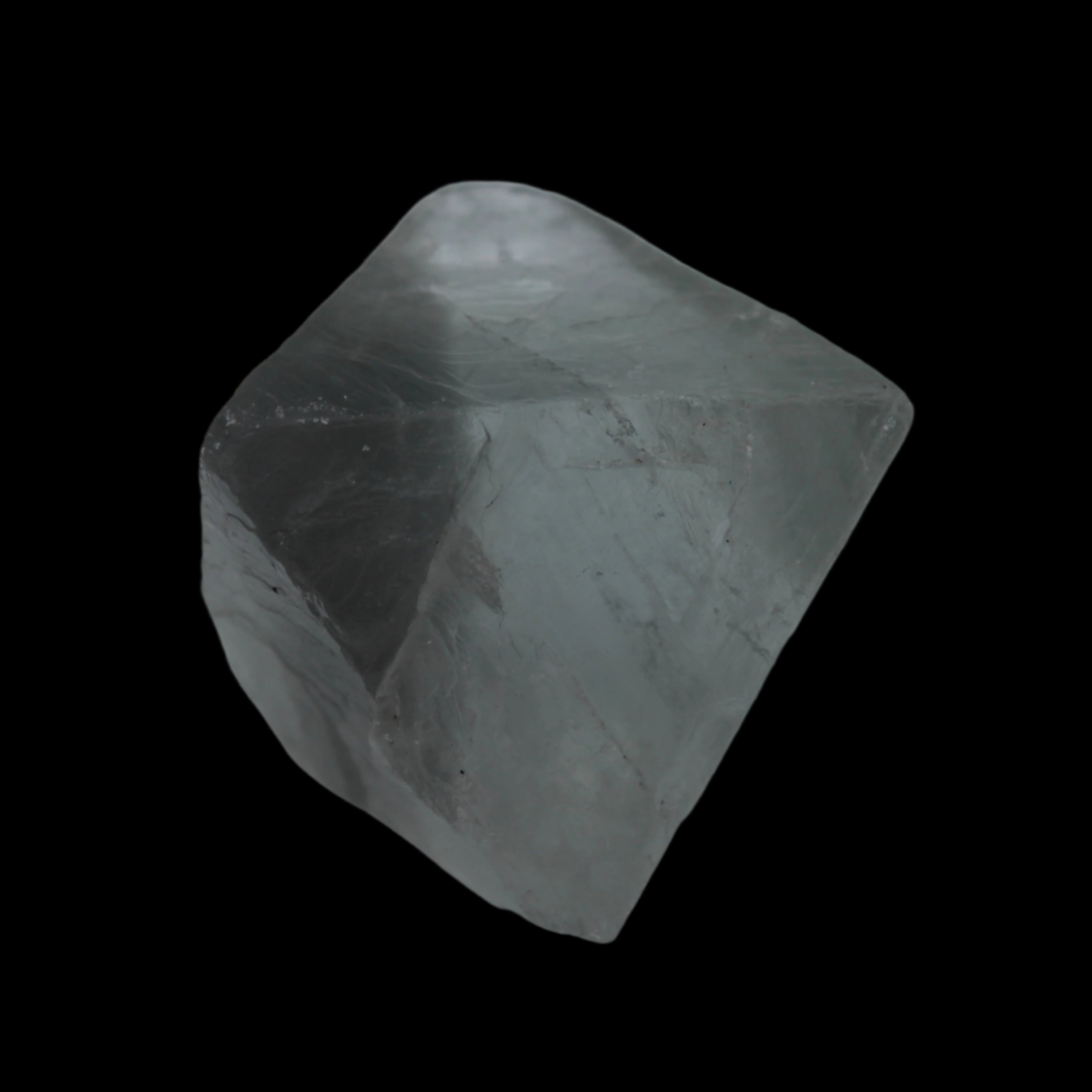 Fluorite octahedral crystal 26/33g  in dull sunlight - Rocks and Things Store