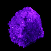Calcite cluster 75g in UV light - Rocks and Things Store
