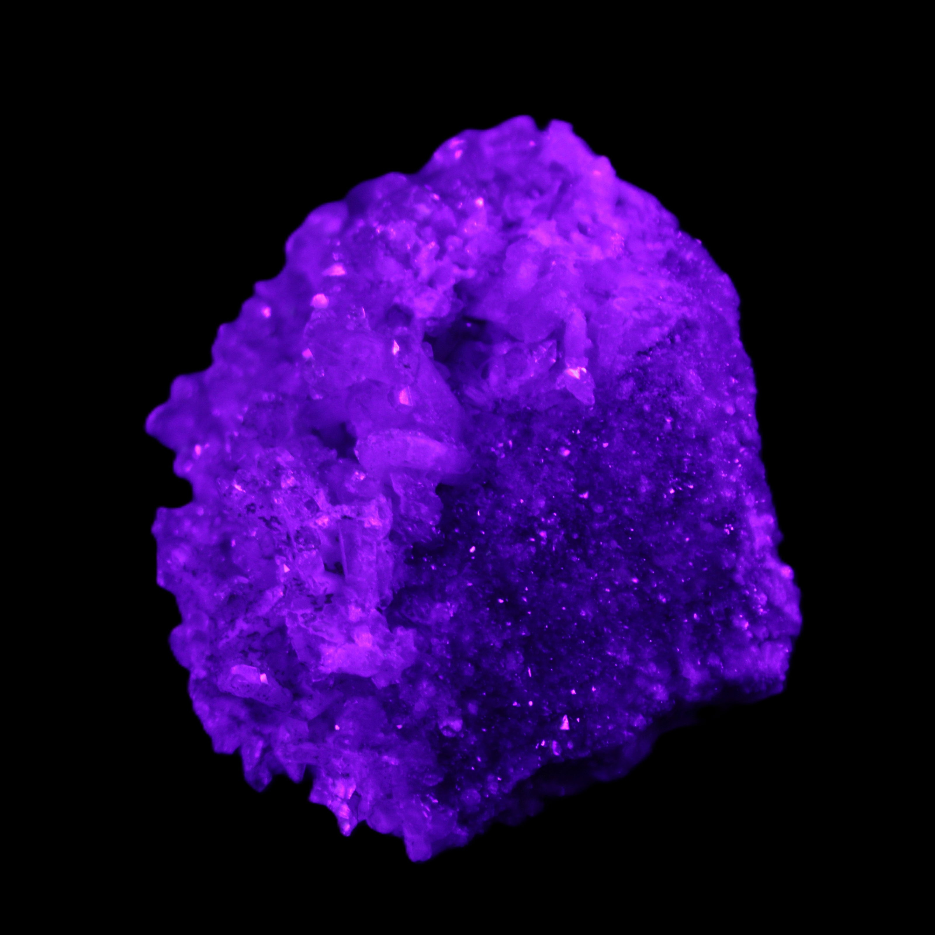 Calcite cluster 75g in UV light - Rocks and Things Store