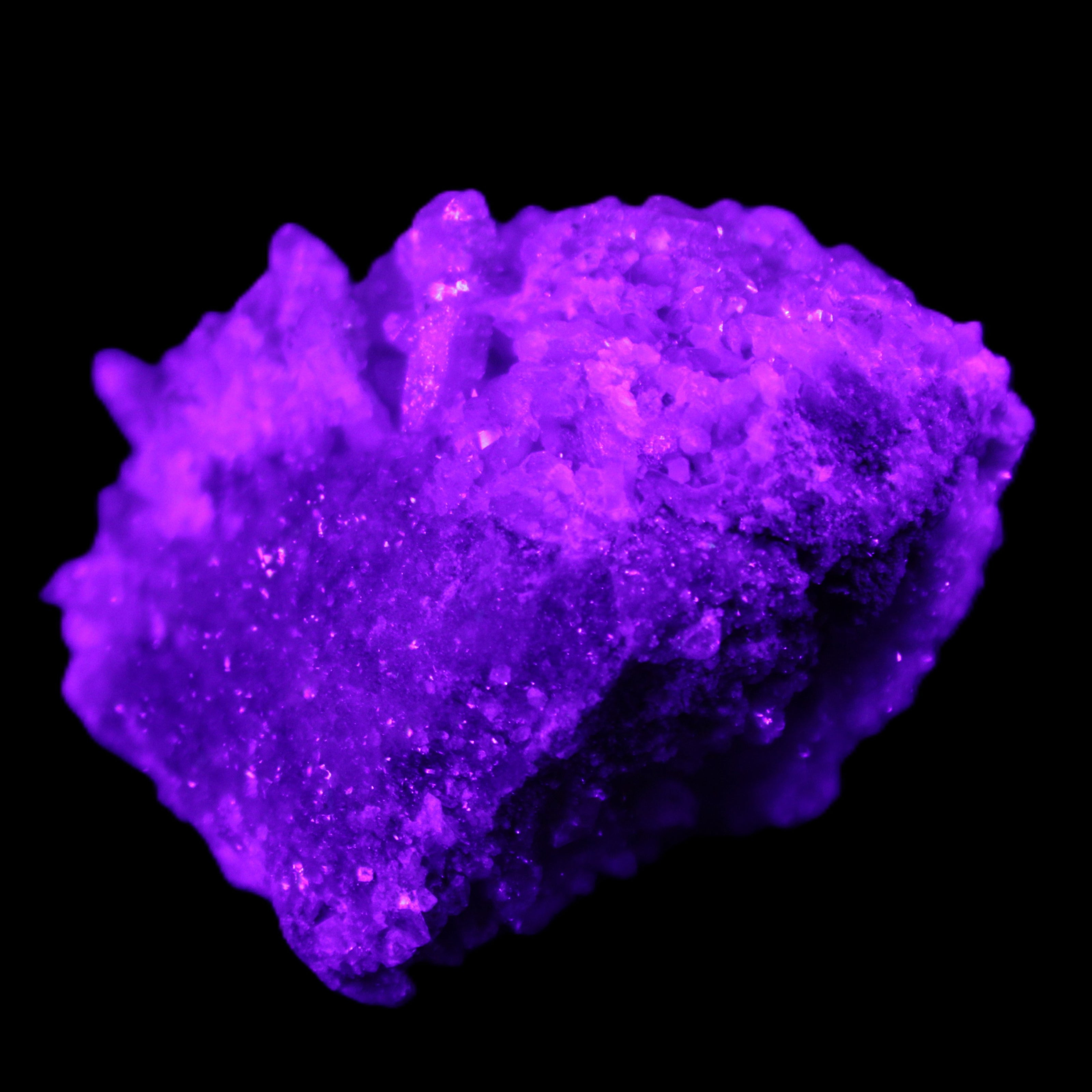 Calcite cluster 75g in UV light - Rocks and Things Store