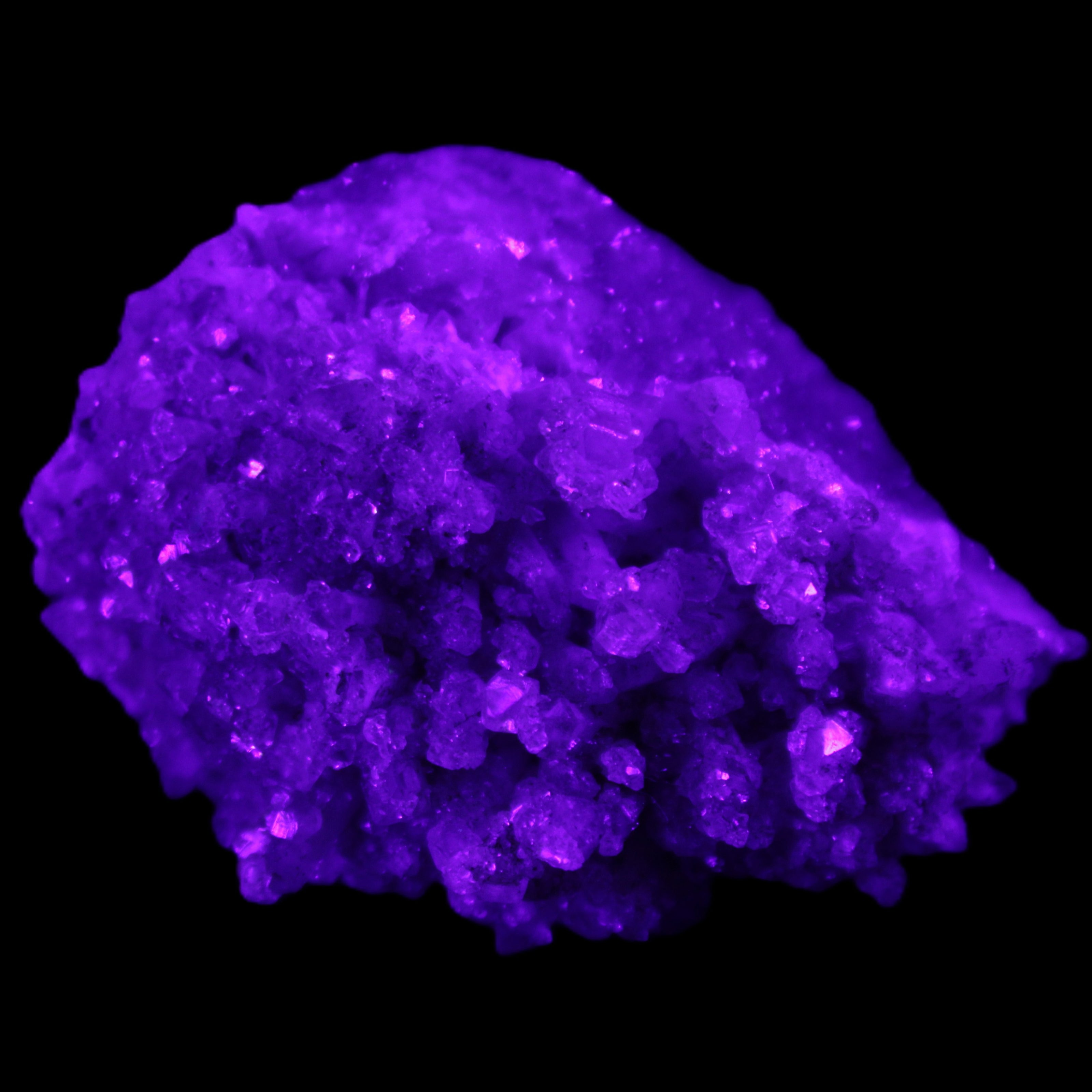 Calcite cluster 75g in UV light - Rocks and Things Store