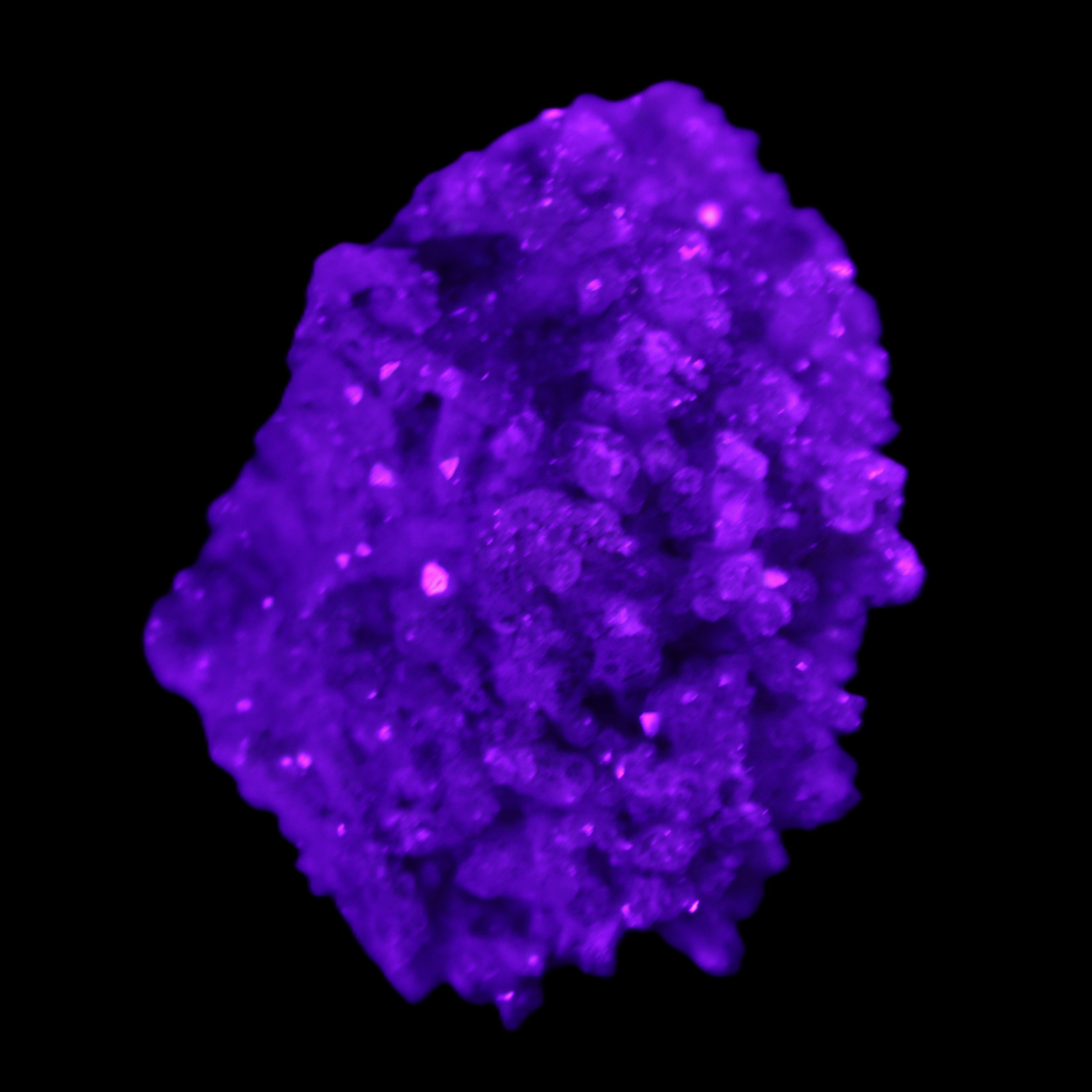 Calcite cluster 75g in UV light - Rocks and Things Store