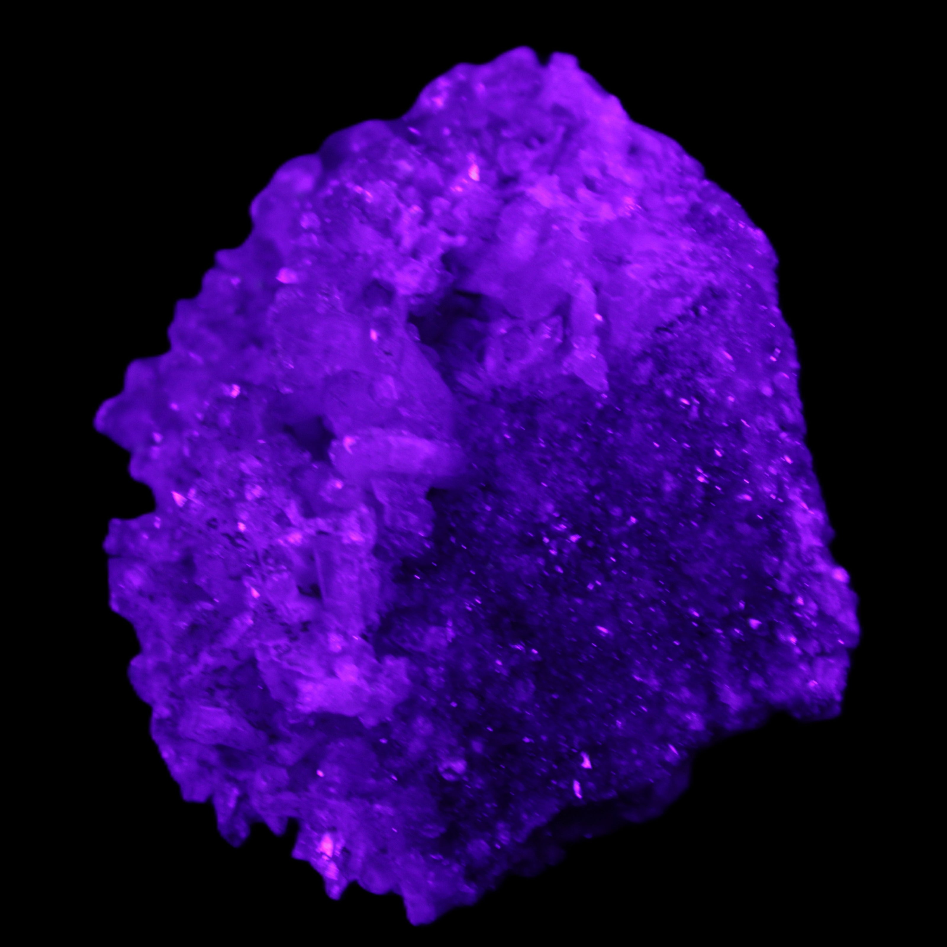 Calcite cluster 75g in UV light - Rocks and Things Store