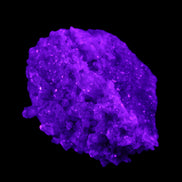 Calcite cluster 75g in UV light - Rocks and Things Store