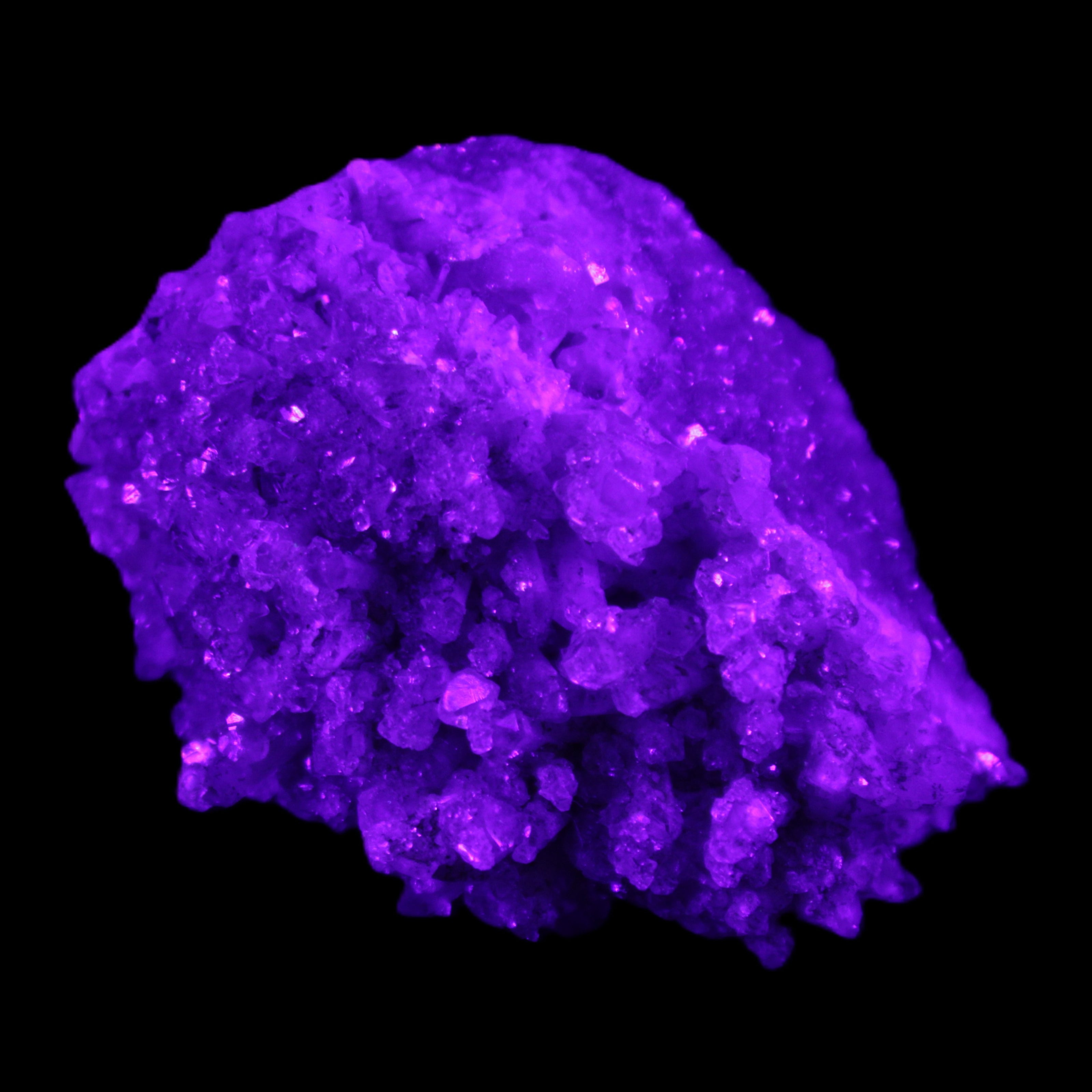 Calcite cluster 75g in UV light - Rocks and Things Store