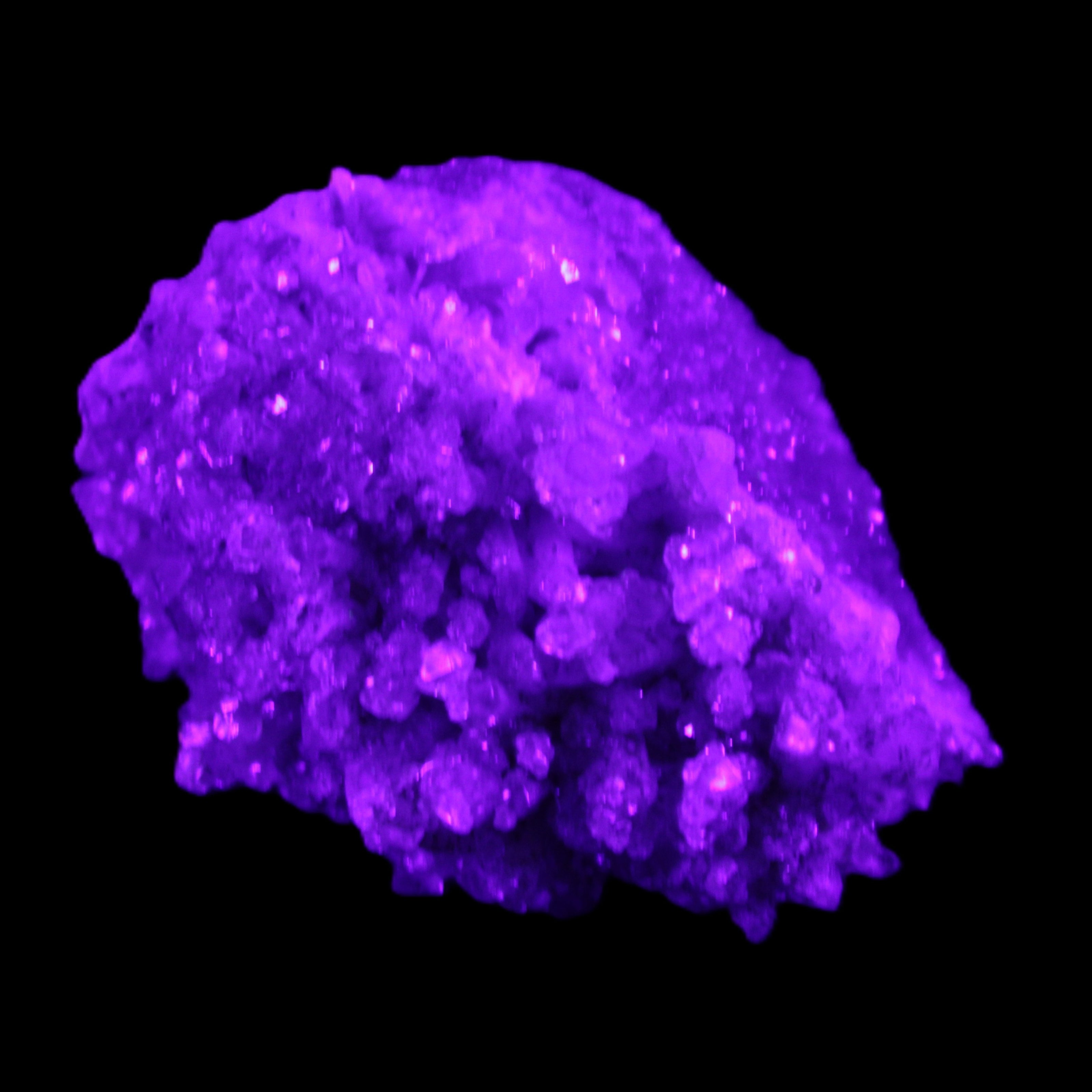 Calcite cluster 75g in UV light - Rocks and Things Store