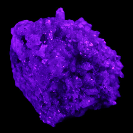 Calcite cluster 75g in UV light - Rocks and Things Store