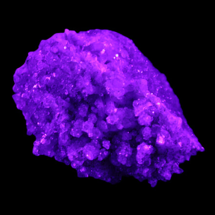 Calcite cluster 75g in UV light - Rocks and Things Store