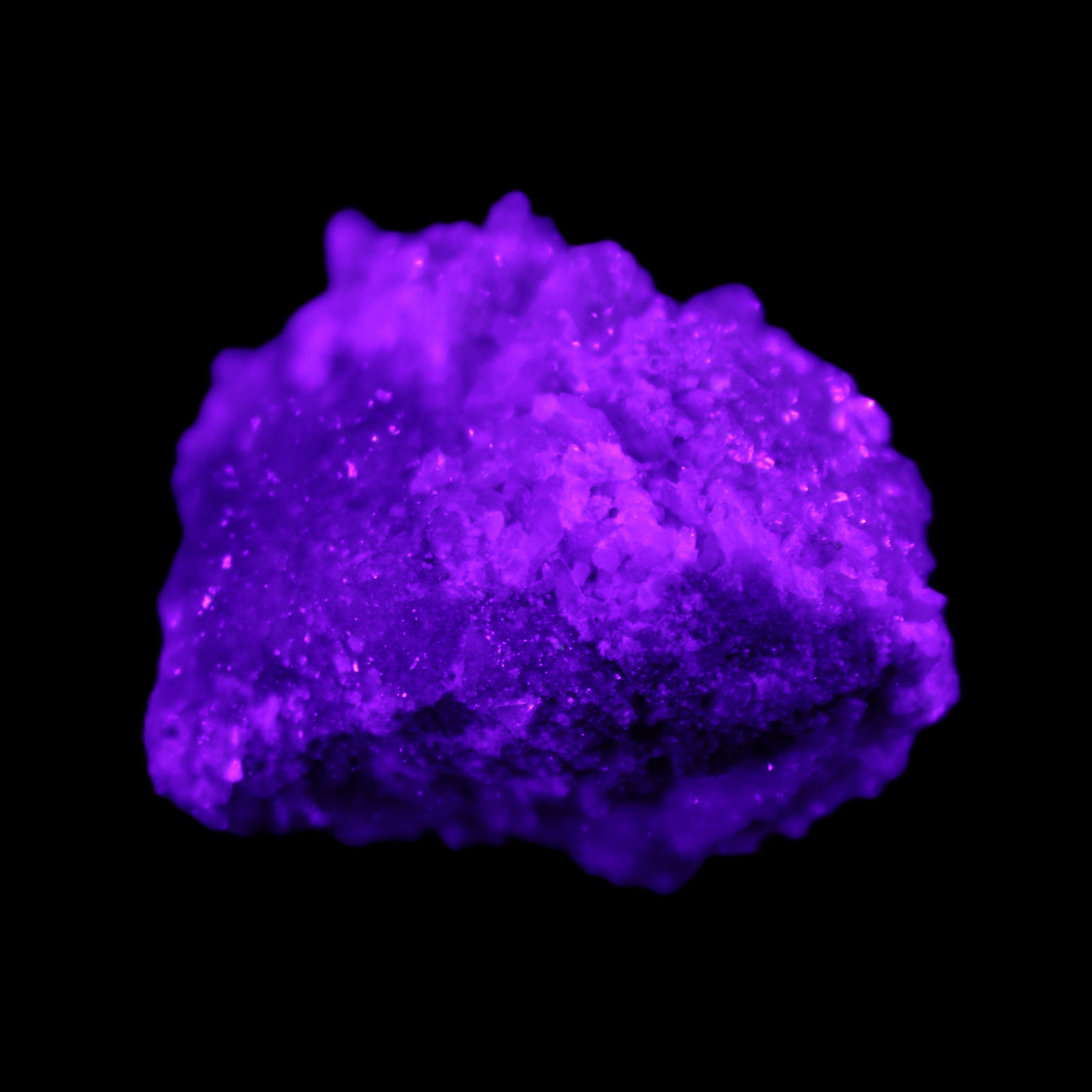 Calcite cluster 75g in UV light - Rocks and Things Store