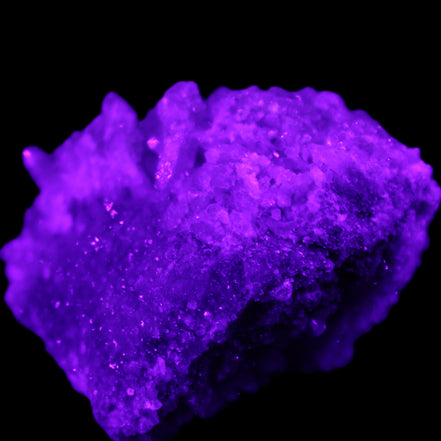 Calcite cluster 75g in UV light - Rocks and Things Store