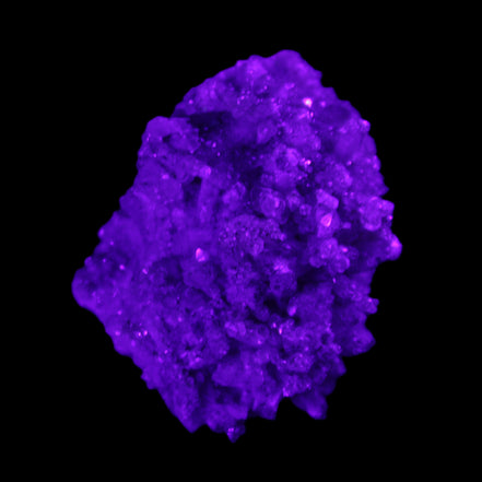 Calcite cluster 75g in UV light - Rocks and Things Store