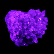 Calcite cluster 75g in UV light - Rocks and Things Store