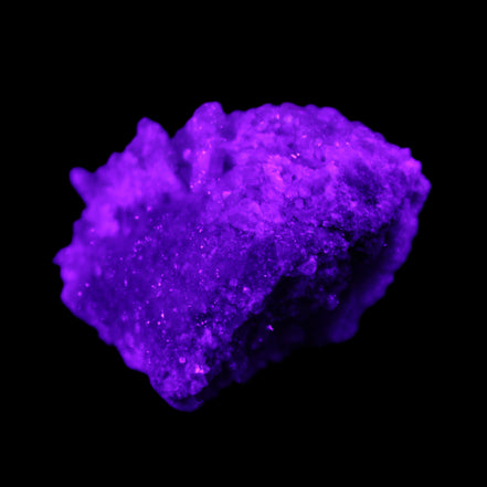 Calcite cluster 75g in UV light - Rocks and Things Store