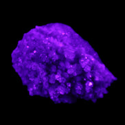 Calcite cluster 75g in UV light - Rocks and Things Store