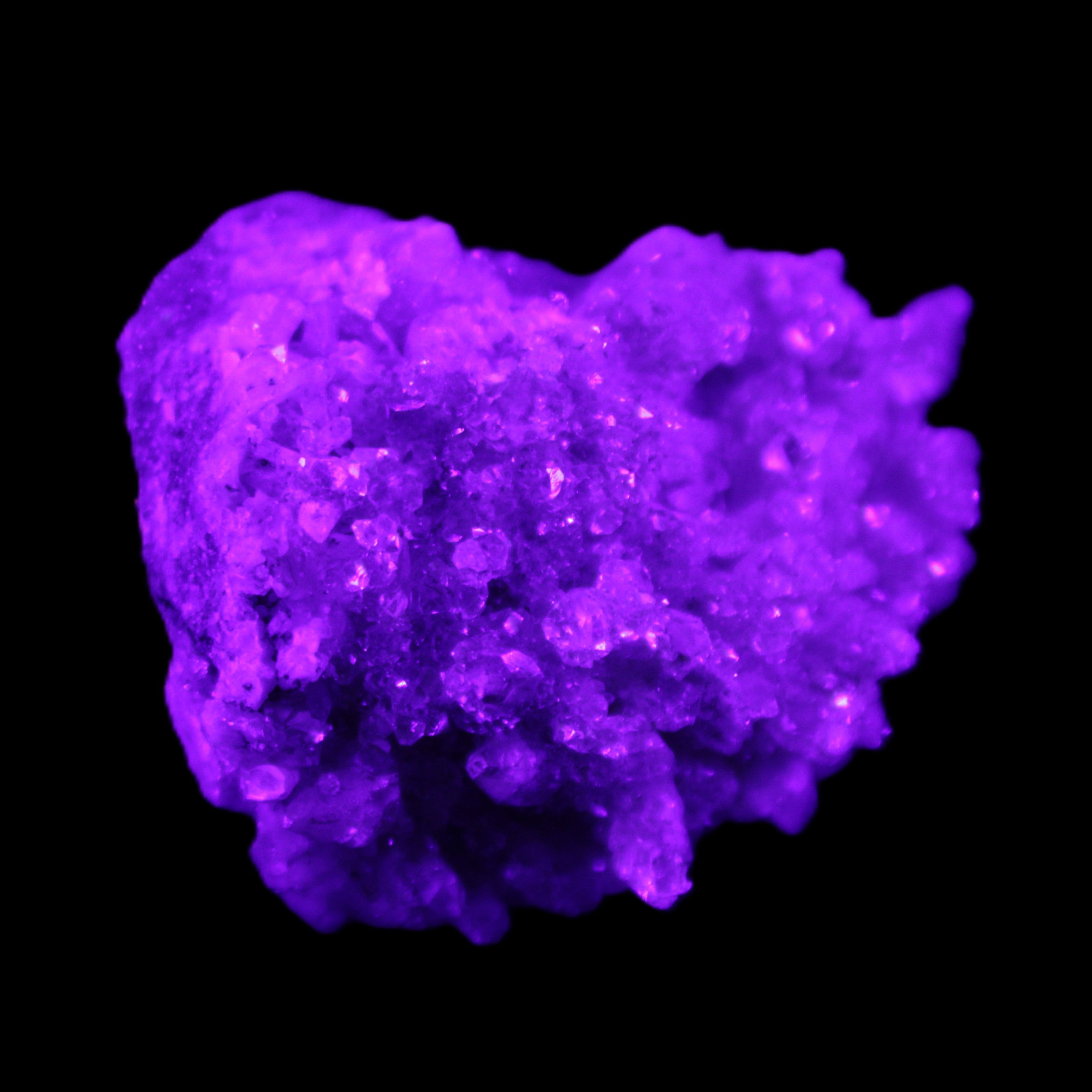 Calcite cluster 75g in UV light - Rocks and Things Store
