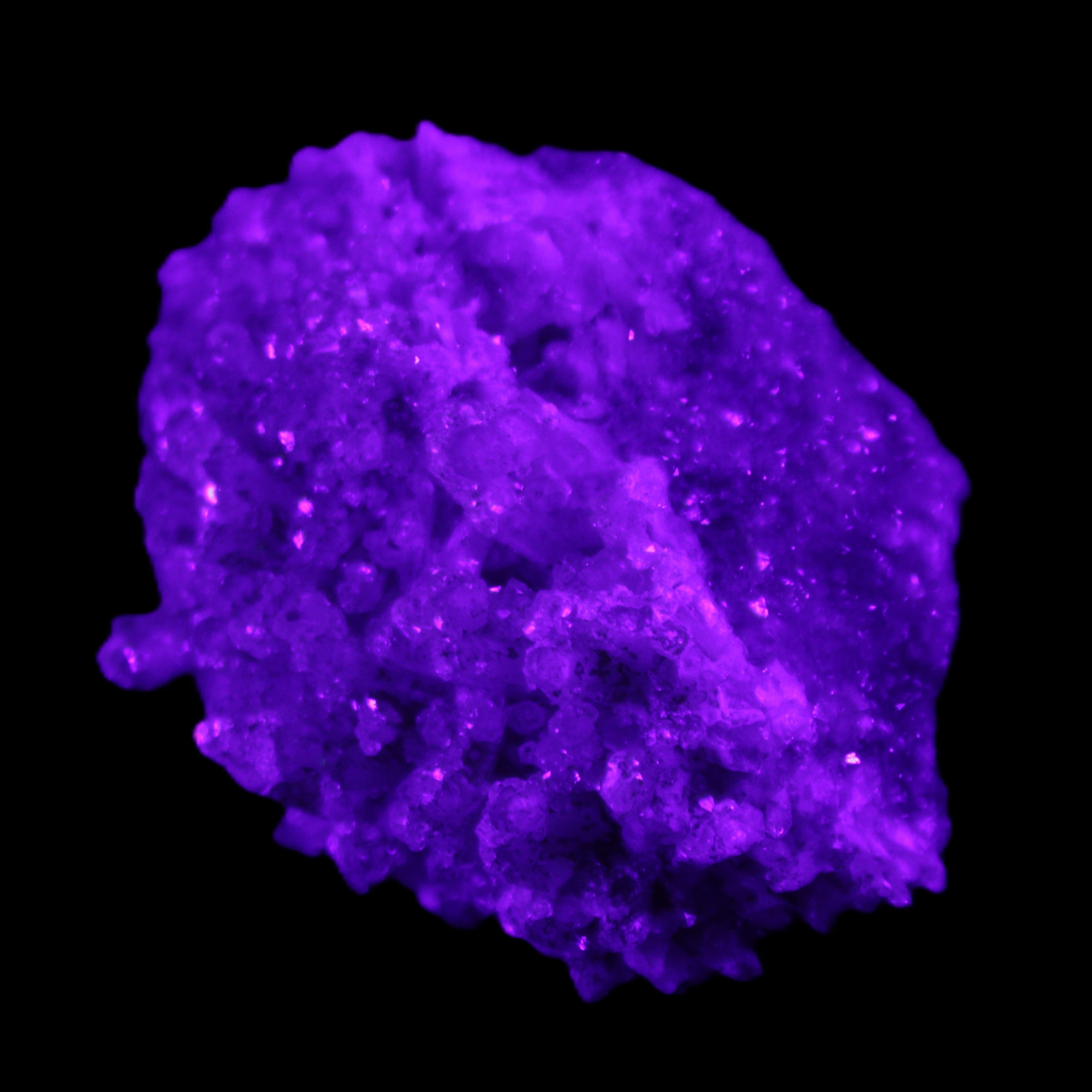 Calcite cluster 75g in UV light - Rocks and Things Store